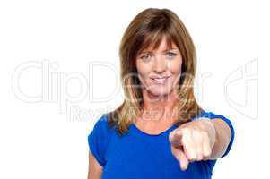 Casual woman pointing towards you