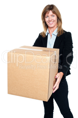 Pretty woman carrying a box