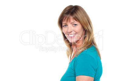 Happy woman in casuals posing sideways