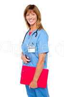 Smiling medical nurse with clipboard