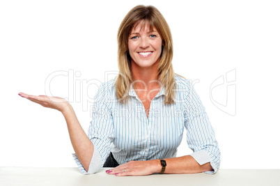 Business lady posing with an open palm