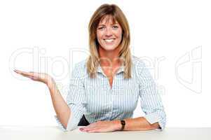Business lady posing with an open palm