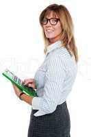 Corporate lady using big green calculator