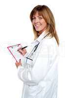 Beautiful smiling physician writing prescription