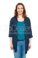 Smiling middle aged woman wearing blue cardigan