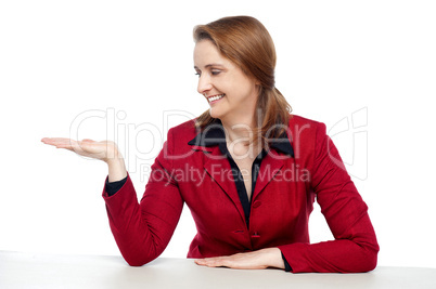 Attractive businesswoman presenting copy space