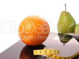 Scale with fresh fruits