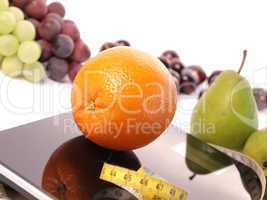 Scale with fresh fruits