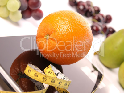 Scale with fresh fruits