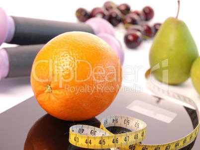 Scale with fresh fruits