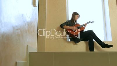 Teenager Girl Playing Guitar