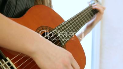 Teen Girl Playing Guitar