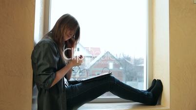 Teenager Girl With a Tablet Computer