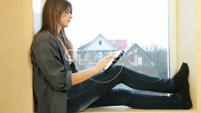 Teenager Girl Listening Music On Digital Tablet