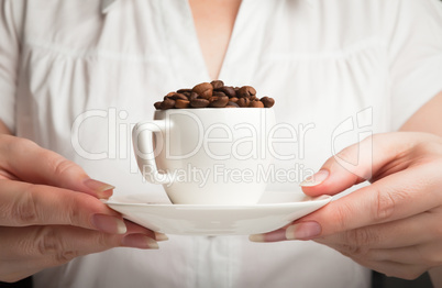 Hands holding a cup