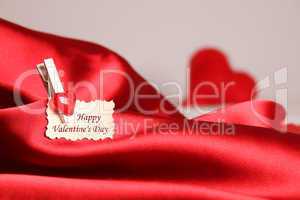 Greeting card for Valentine's Day, on red satin