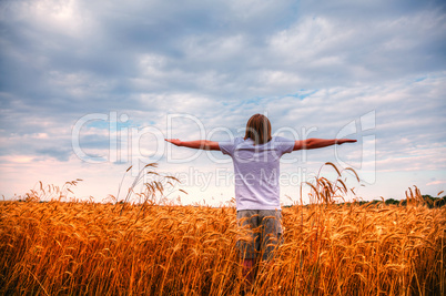 Young man staying with stretched out hands