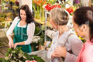 Young florist preparing cut flowers shop buyers