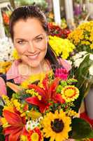 Smiling florist woman colorful bouquet flower market