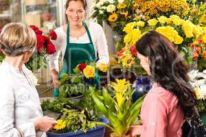 Florist woman preparing bouquet customers flower shop