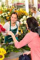 Young florist ordering roses woman customer flower