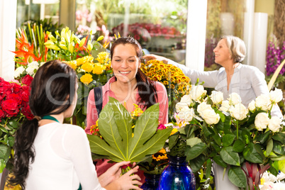 Young woman buying bouquet flower shop customer