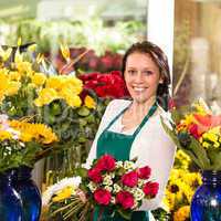 Cheerful female florist bouquet roses flower shop