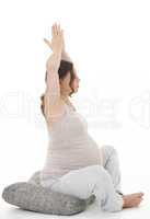 schwangere frau macht yoga