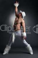 Sexy athletic dancer in white cowboy costume