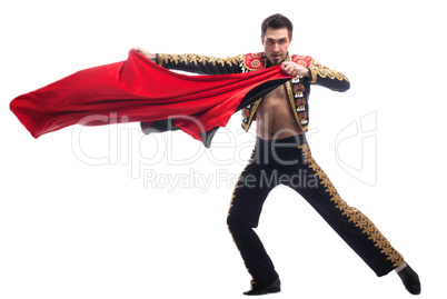 Handsome toreador in black costume with red cloth