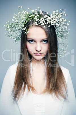 spring portrait  girl with wreath of flowers