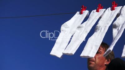 Male Hanging Socks to Dry