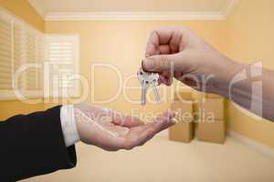 Handing Over the House Keys Inside Empty Room