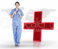 Nurse standing by digital red cross