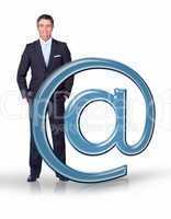 Businessman standing with email at symbol