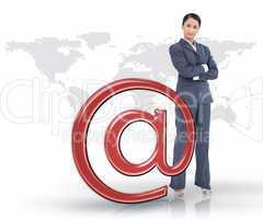 Businesswoman standing by red at email symbol