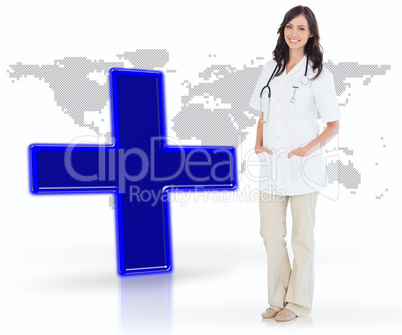 Nurse standing by digital blue cross