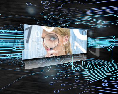 Screen showing woman with magnifying glass in circuit board