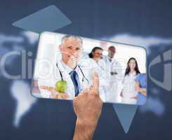 Hand selecting image of doctor holding apple