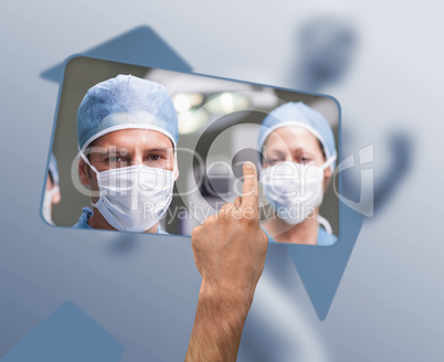 Hand selecting image of surgeons