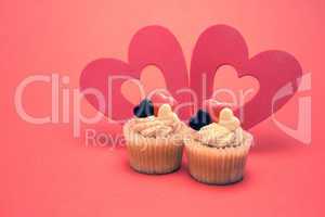 Two valentines cupcakes with heart decorations