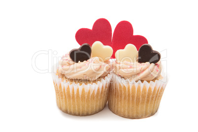 Two valentines cupcakes with heart decorations