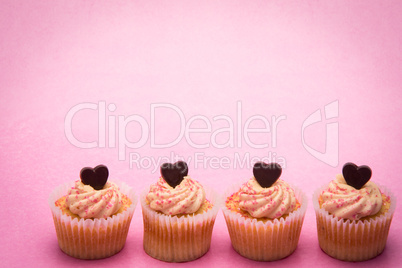 Four valentines cupcakes in a row