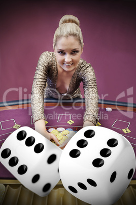 Blonde woman grabbing chips with digital dice