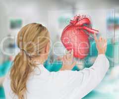 Doctor consulting touchscreen displaying heart diagram
