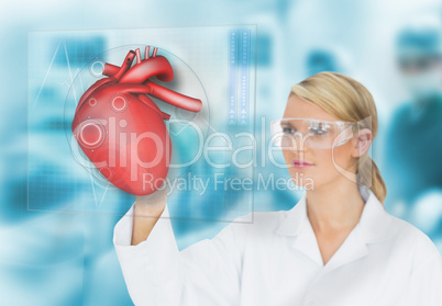 Doctor consulting heart diagram on touchscreen display