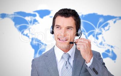 Smiling businessman using headset