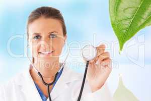 Doctor holding up stethoscope for natural treatment