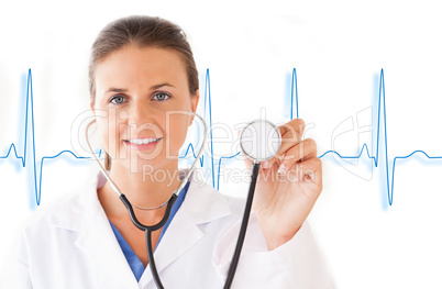 Smiling doctor holding up stethoscope