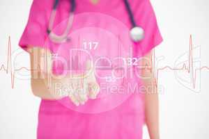 Nurse in pink scrubs touching red ECG line with figures